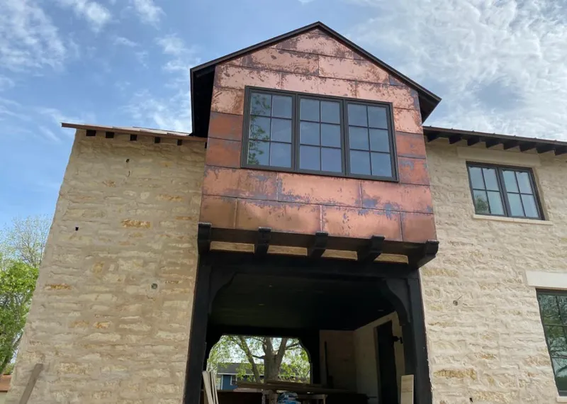 Copper metal panel facade on a stone building for Metal Roof Coating in Lumberton